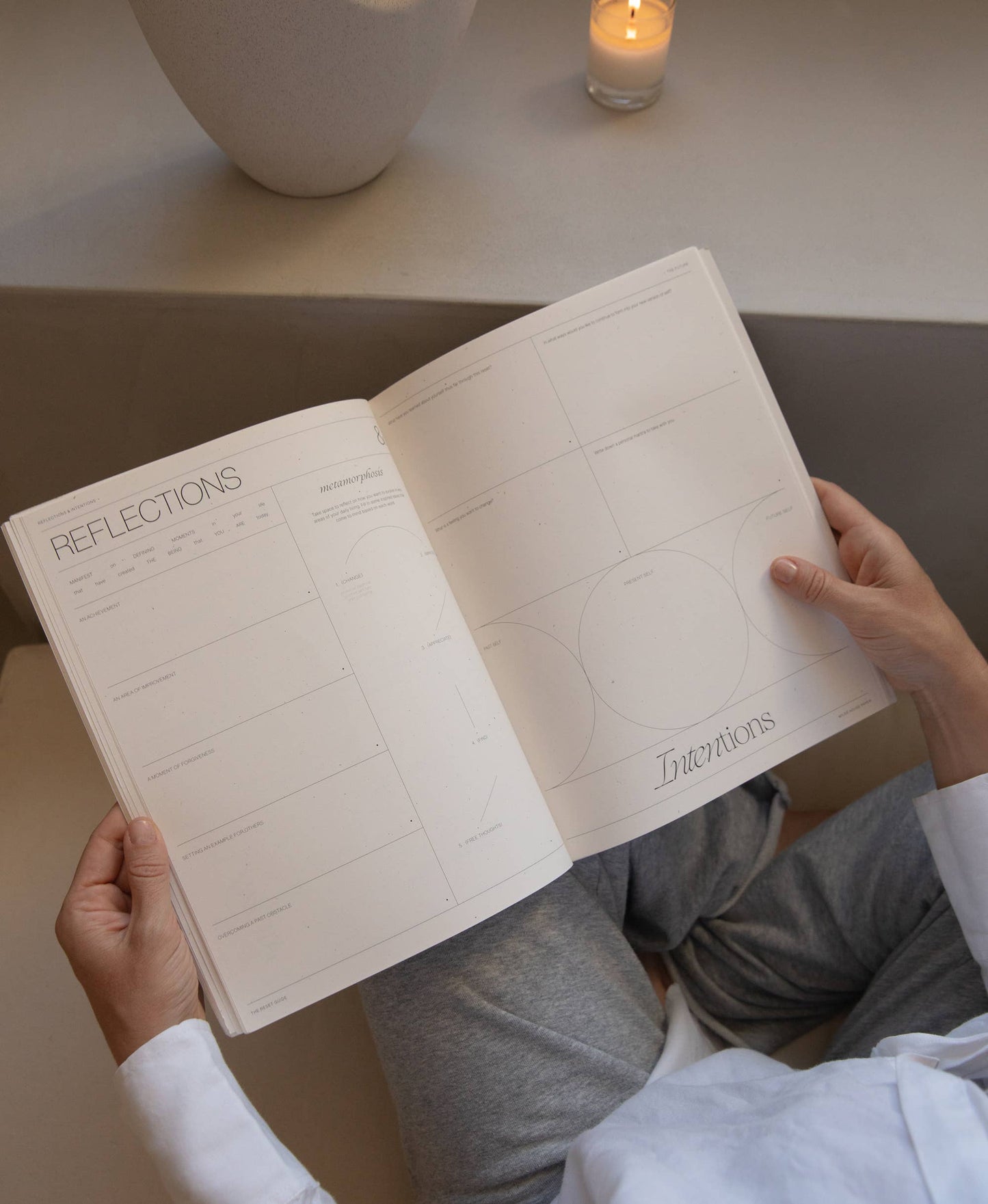 Minimalist beige guided journal titled "The Reset Guide" with soft circular design, created for personal growth and self-reflection through past, present, and future prompts.
