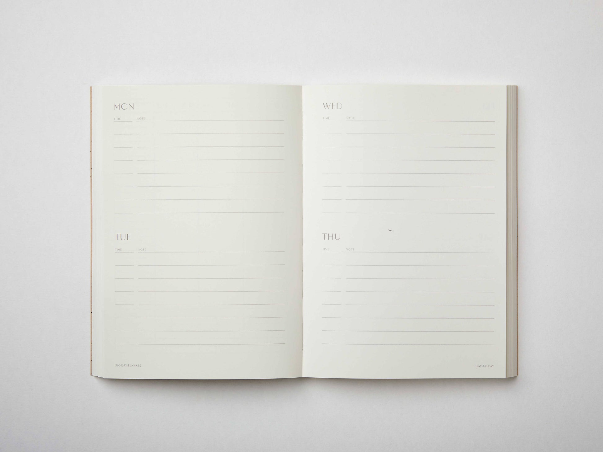 Moss green undated planner with large ‘365’ in white typeface on textured cover – minimal, modern daily planner printed in the UK.